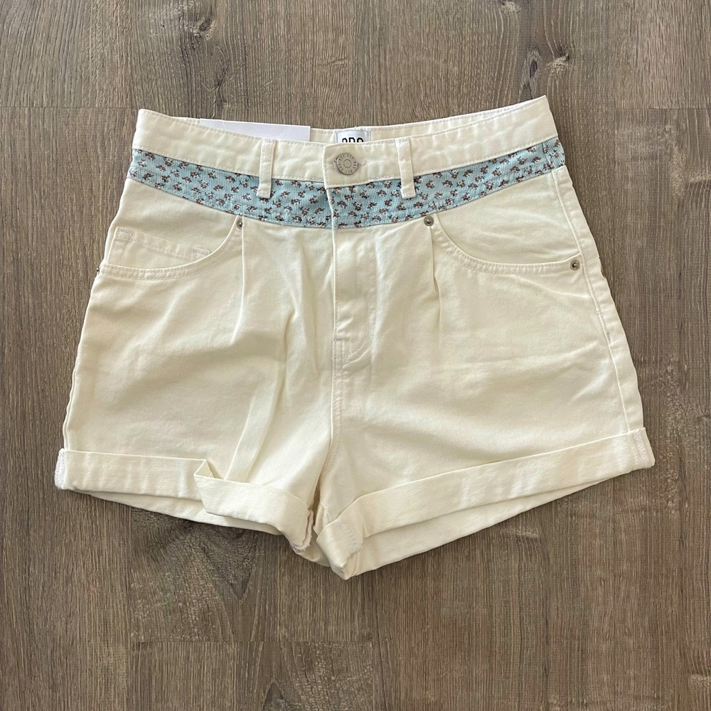 Never been worn! White shorts with floral print. Mom-style.